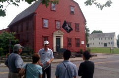 Stopped outside the White Horse Tavern, this tour group learns about the Nichols family.